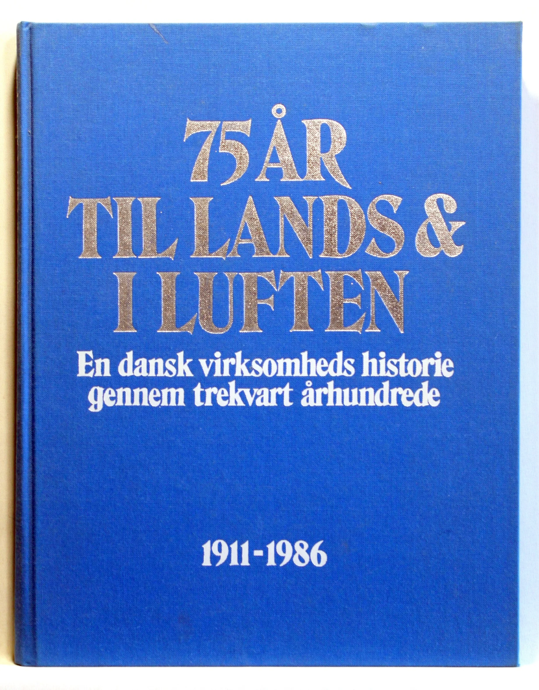 75 år til lands & i luften. En dansk virksomheds historie gennem trekvart århundrede 1911-1986
